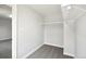 Walk-in closet with built-in shelving and modern minimalist design at 8701 E Briarwood Blvd, Centennial, CO 80112