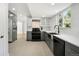 Modern kitchen featuring gray cabinets, stainless steel appliances, and a sleek design with natural light at 8701 E Briarwood Blvd, Centennial, CO 80112