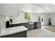 Well-lit kitchen with gray cabinetry, stainless steel appliances, and an open layout perfect for cooking at 8701 E Briarwood Blvd, Centennial, CO 80112