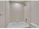 This bathroom features a white tiled shower over tub combination at 2972 W Long Dr # C, Littleton, CO 80120