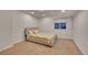 Bedroom featuring neutral carpet and a yellow patterned bed at 2972 W Long Dr # C, Littleton, CO 80120