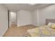 Bedroom with neutral carpet, white walls, and double doors to closet space at 2972 W Long Dr # C, Littleton, CO 80120