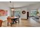 Open concept dining room with access to living room and sliding glass door at 2972 W Long Dr # C, Littleton, CO 80120