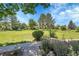 Well-manicured front yard with lush greenery and landscaping on a sunny day at 2972 W Long Dr # C, Littleton, CO 80120