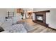 Spacious living area with a fireplace and view to the open kitchen and dining space at 2972 W Long Dr # C, Littleton, CO 80120