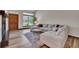 Cozy living room featuring a large window, fireplace and comfortable seating at 2972 W Long Dr # C, Littleton, CO 80120