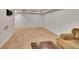 Open living room area featuring neutral carpet and a couch at 2972 W Long Dr # C, Littleton, CO 80120