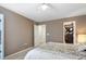 Bedroom with a queen-size bed and access to a shared bath at 5593 S Himalaya Way, Centennial, CO 80015