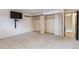 Bedroom featuring spacious closet with bi-fold doors and TV at 1200 S Monaco St Pkwy # 31, Denver, CO 80224