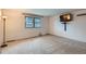 Bedroom showcasing natural light through the window and mounted TV at 1200 S Monaco St Pkwy # 31, Denver, CO 80224