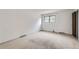 Bright bedroom featuring neutral carpeting and a window for natural light at 1200 S Monaco St Pkwy # 31, Denver, CO 80224
