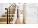 Inviting hallway with hardwood floors, staircase, and natural light at 1200 S Monaco St Pkwy # 31, Denver, CO 80224