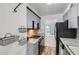 Efficient kitchen layout with stainless steel appliances and functional storage solutions at 1200 S Monaco St Pkwy # 31, Denver, CO 80224