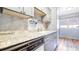 Well-maintained kitchen featuring granite countertops, gray cabinetry, and stainless steel appliances at 1200 S Monaco St Pkwy # 31, Denver, CO 80224