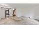 Bright living room showcasing neutral carpet and easy access to the kitchen and stairs at 1200 S Monaco St Pkwy # 31, Denver, CO 80224