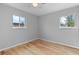 Bright, airy bedroom features hardwood floors and large windows for plenty of natural light at 3222 S Fairfax St, Denver, CO 80222