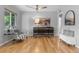 Bright living room with hardwood floors, stylish furnishings, and a modern accent console at 3222 S Fairfax St, Denver, CO 80222