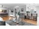 Contemporary living area with a seamless layout connecting the living room, kitchen, and bar seating at 3222 S Fairfax St, Denver, CO 80222