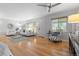 Cozy living room featuring ample natural light, hardwood floors, and modern furnishings at 3222 S Fairfax St, Denver, CO 80222