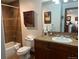 Cozy bathroom featuring tiled shower-tub, toilet, and rustic vanity with neutral counter top at 34 Highfield Trl # 212, Breckenridge, CO 80424