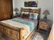 Charming bedroom with log furniture, bear motif decor and cozy bedding at 34 Highfield Trl # 212, Breckenridge, CO 80424