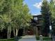 A charming entryway surrounded by lush trees and landscaping welcomes you to the property at 34 Highfield Trl # 212, Breckenridge, CO 80424