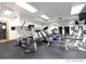 Well-equipped gym features treadmill, elliptical machine, weights, and mirrored wall at 34 Highfield Trl # 212, Breckenridge, CO 80424
