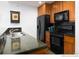 Modern kitchen with dark countertops and black appliances, complete with stainless steel sink at 34 Highfield Trl # 212, Breckenridge, CO 80424