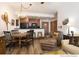 Living room features rustic decor with kitchen in background, wood flooring and comfortable seating at 34 Highfield Trl # 212, Breckenridge, CO 80424