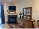 Comfortable living room with fireplace, TV, wood floors, and access to the patio at 34 Highfield Trl # 212, Breckenridge, CO 80424