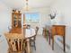 Inviting dining room with traditional wooden furniture, perfect for Gathering meals and entertaining guests at 16275 Electra St, Brighton, CO 80603