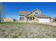 Beautiful two-story home with an attached two-car garage, complemented by well-maintained landscaping and a barn at 16275 Electra St, Brighton, CO 80603