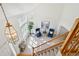 A view from the upper floor looking down at the chandelier, entry and stairwell at 16275 Electra St, Brighton, CO 80603