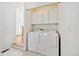 Laundry area with a side-by-side washer and dryer and extra storage space at 16275 Electra St, Brighton, CO 80603