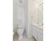 Cozy powder room with a toilet, sink, and vanity at 16275 Electra St, Brighton, CO 80603