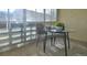 Bright sunroom with a glass-top table and chairs at 680 S Alton Way # 3A, Denver, CO 80247