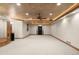 Large finished basement with recessed lighting, a ceiling fan, and ample space for customization at 4 Redhawk Run, Englewood, CO 80113