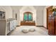 Bright bedroom with large window seat, plush poufs, and charming decor at 4 Redhawk Run, Englewood, CO 80113