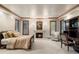 Serene main bedroom with a fireplace, plush carpeting, and custom built-ins for storage and style at 4 Redhawk Run, Englewood, CO 80113
