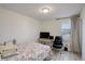 Cozy bedroom featuring a functional desk area and soft natural light from the window at 4754 N Joplin St, Denver, CO 80239