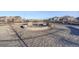 Wide shot of the neighborhood dog park covered in sand and dog houses at 4754 N Joplin St, Denver, CO 80239