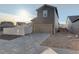 Exterior view of home featuring a driveway, garage, and gray siding at 4754 N Joplin St, Denver, CO 80239