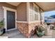 Inviting front porch featuring stylish seating and brick accents at 4754 N Joplin St, Denver, CO 80239