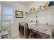 Well-equipped laundry room features modern washer and dryer with ample shelving at 4754 N Joplin St, Denver, CO 80239