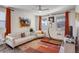 Bright and stylish living room with white sofas, and a colorful rug at 4754 N Joplin St, Denver, CO 80239