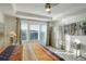 Serene main bedroom with a large windows and light-colored wood floors at 4754 N Joplin St, Denver, CO 80239