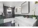 Modern bathroom featuring sleek vanity, black marble tiled shower and stylish fixtures at 1406 Pika Rd, Boulder, CO 80302