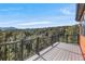 Spacious deck with railings, offering breathtaking views of the surrounding forest at 1406 Pika Rd, Boulder, CO 80302