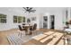 Bright dining area with modern furnishings, natural light, and hardwood floors at 1406 Pika Rd, Boulder, CO 80302