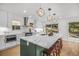 Gourmet kitchen with stainless appliances, quartz counters and a large center island at 1406 Pika Rd, Boulder, CO 80302